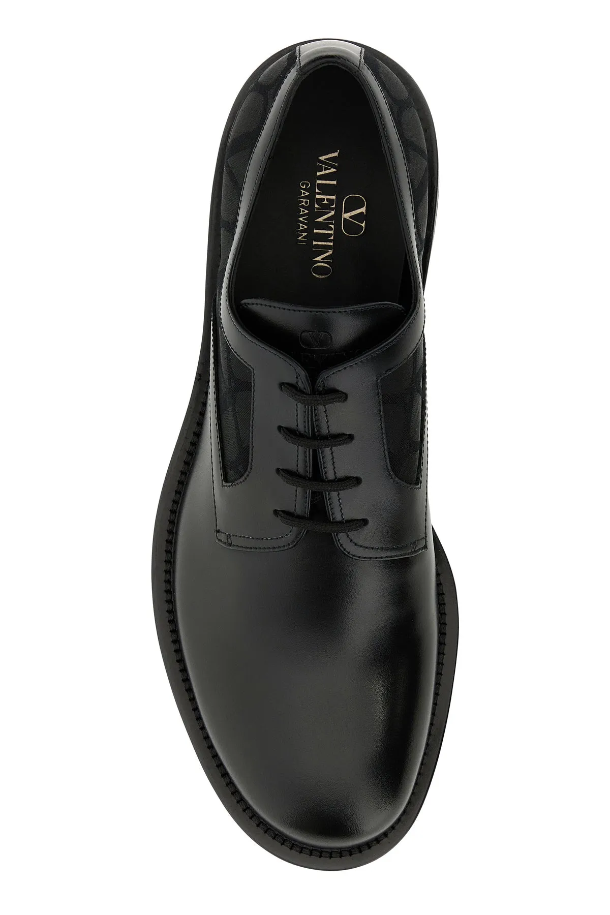 Black leather and Tolie Iconographe lace-up shoes